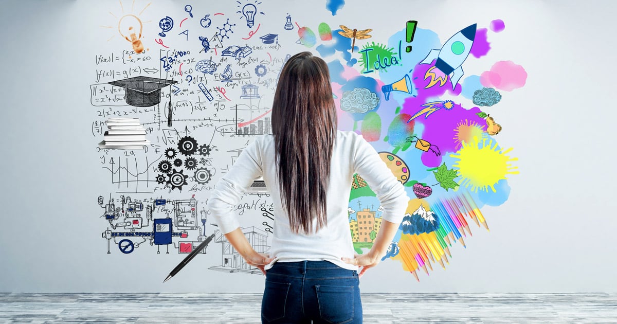 rear view of young woman staring at abstract sketch of left and right brain concept (analytical vs creative)