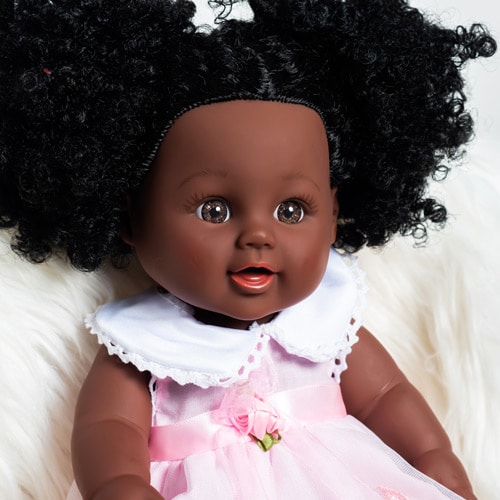 Fusion Dolls black baby doll with curly hair and pink lace dress
