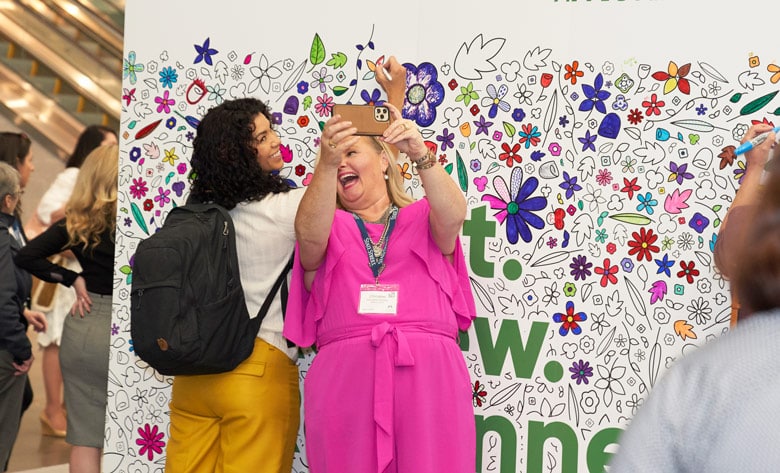 attendees taking a group selfie at the MA Conference for Women