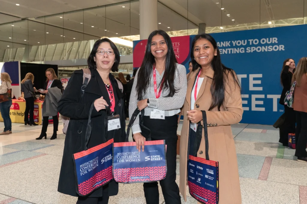 Massachusetts Conference for Women attendees carrying tote bags