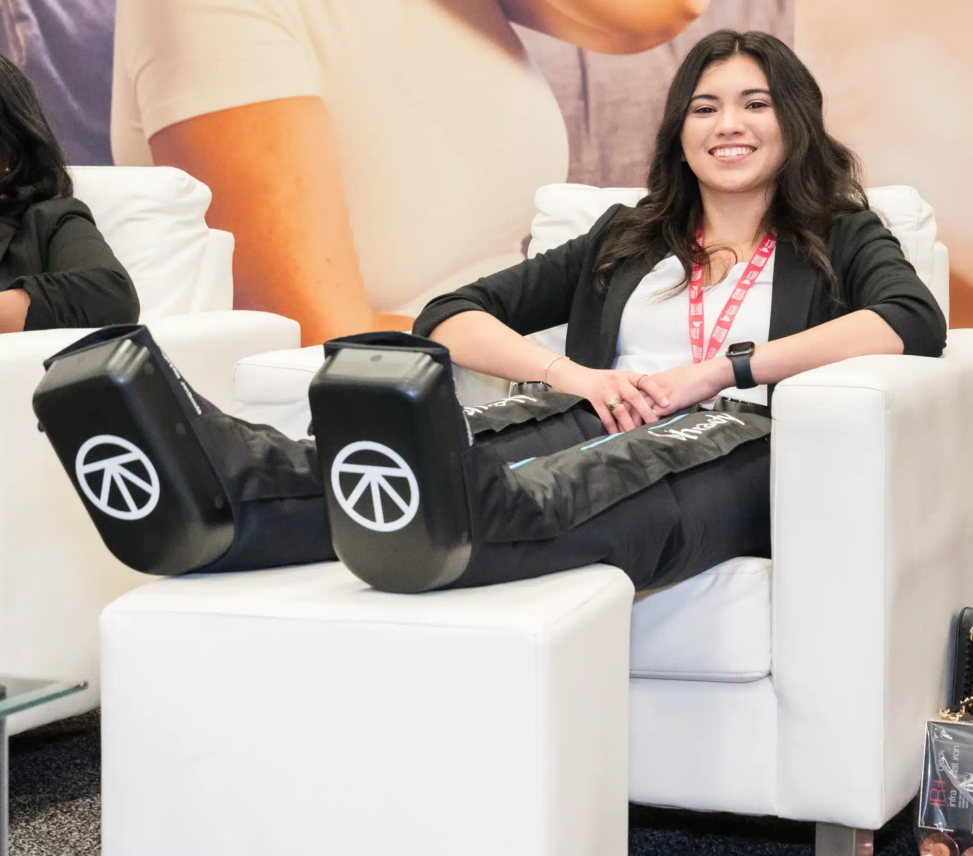 Conference for Women attendee with her feet up in the Interactive Hall lounge