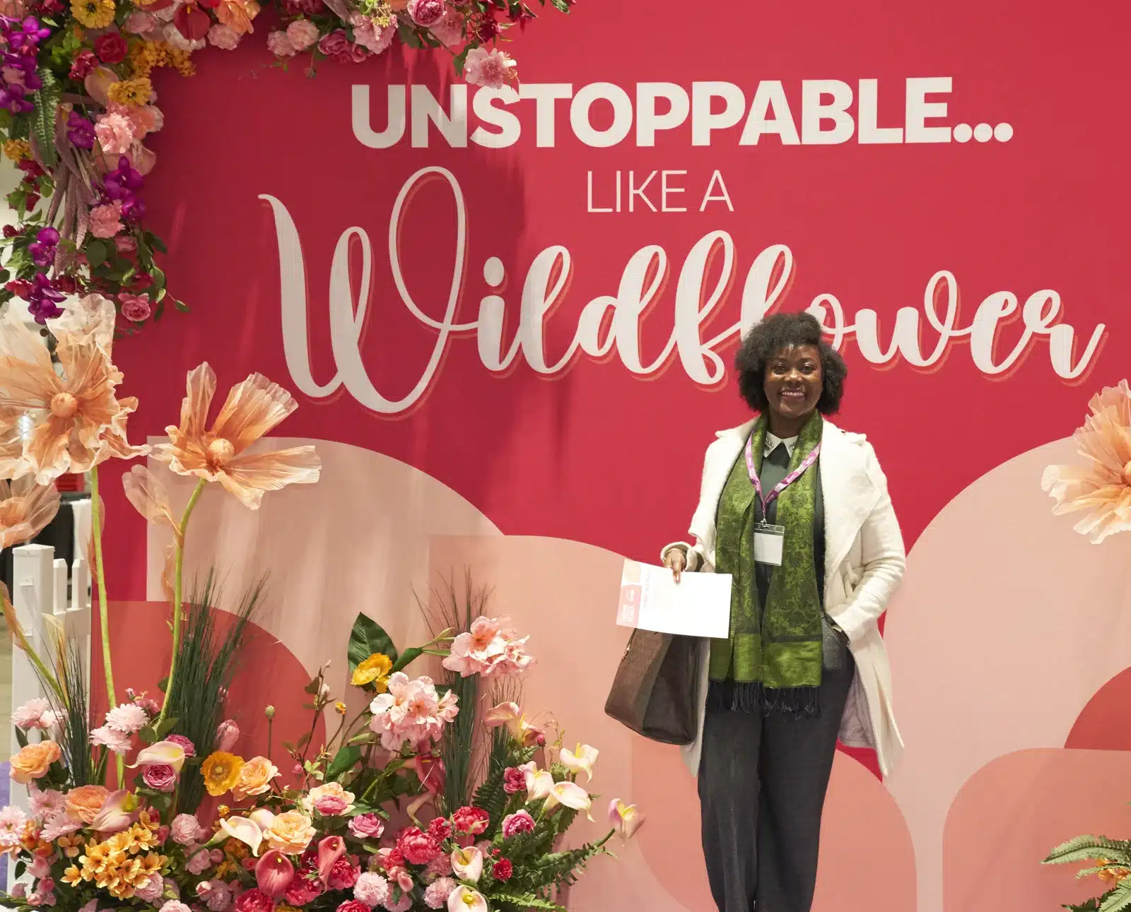 Conference for Women attendee against wildflower backdrop